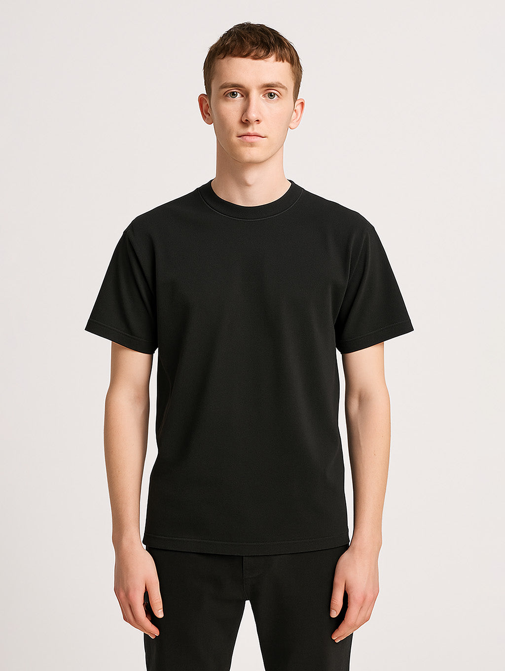 Front view of male model in Black vintage tee by Zarvion – minimalist cotton streetwear T-shirt