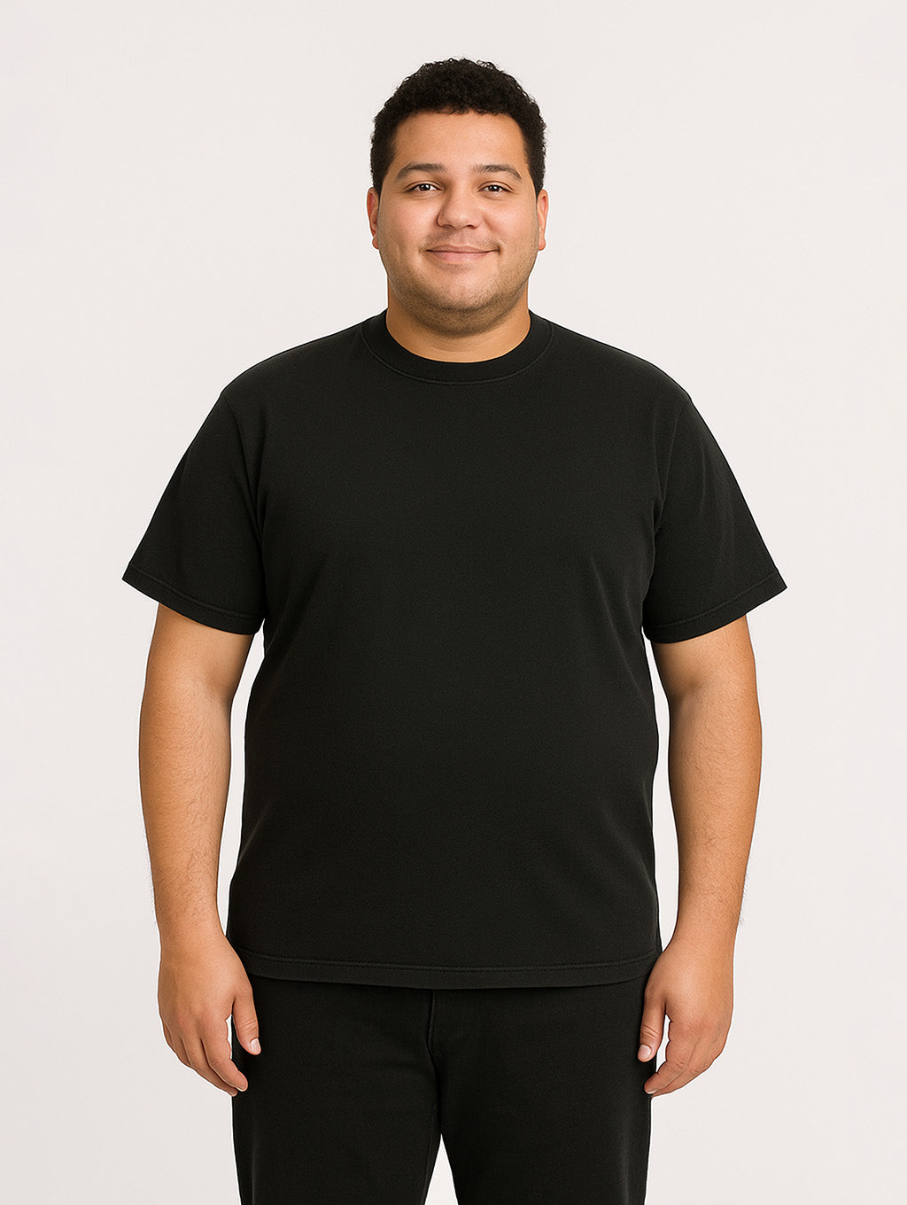 Plus-size male model in Zarvion Black vintage t-shirt – inclusive fit, heavyweight garment-dyed cotton