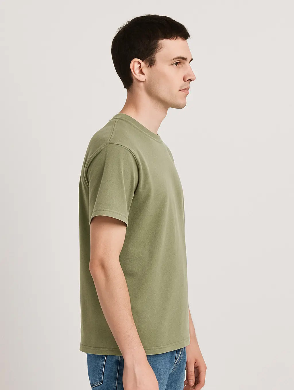 Side profile of male model in Dusty Olive vintage t-shirt – clean relaxed silhouette by Zarvion