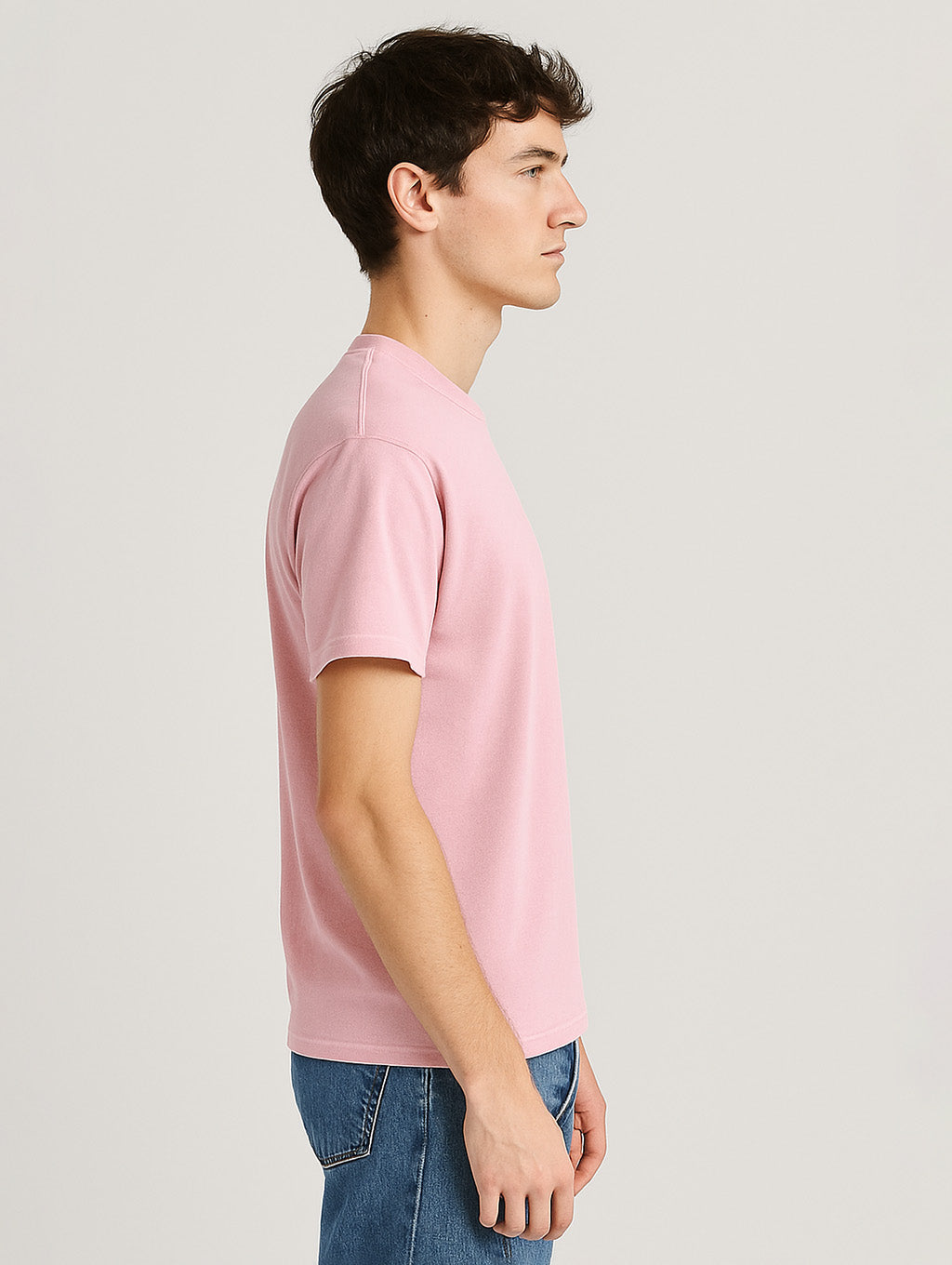 Side view of male model wearing Blush Blossom Pink Zarvion vintage t-shirt – heavyweight relaxed fit style