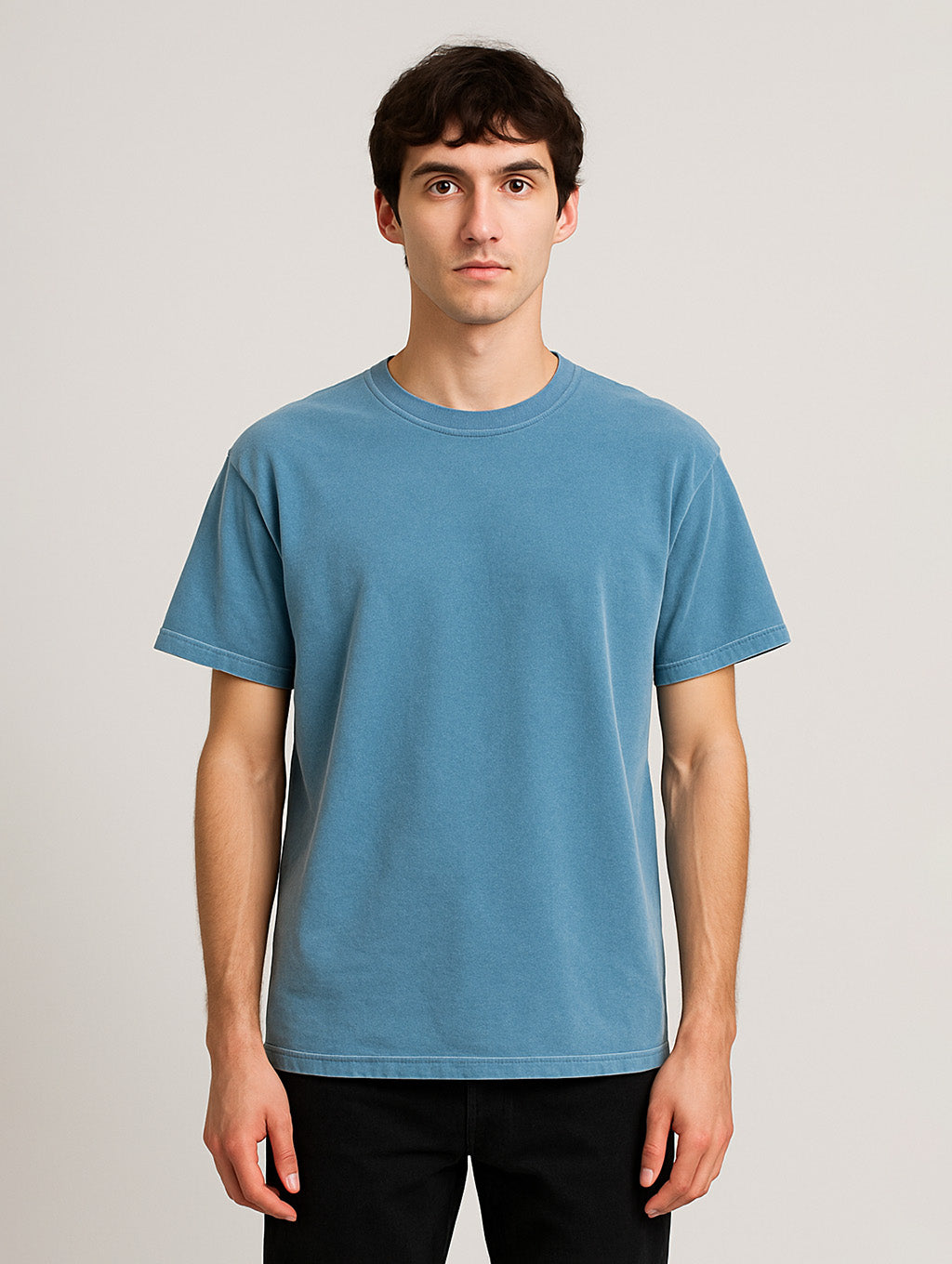 Front view of male model in Worn Denim Blue Zarvion t-shirt – garment-dyed vintage cotton shirt for men
