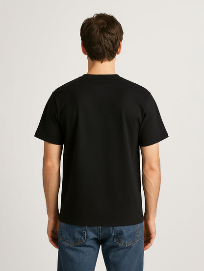Back view of male model wearing Zarvion Premium Tee in black – regular fit