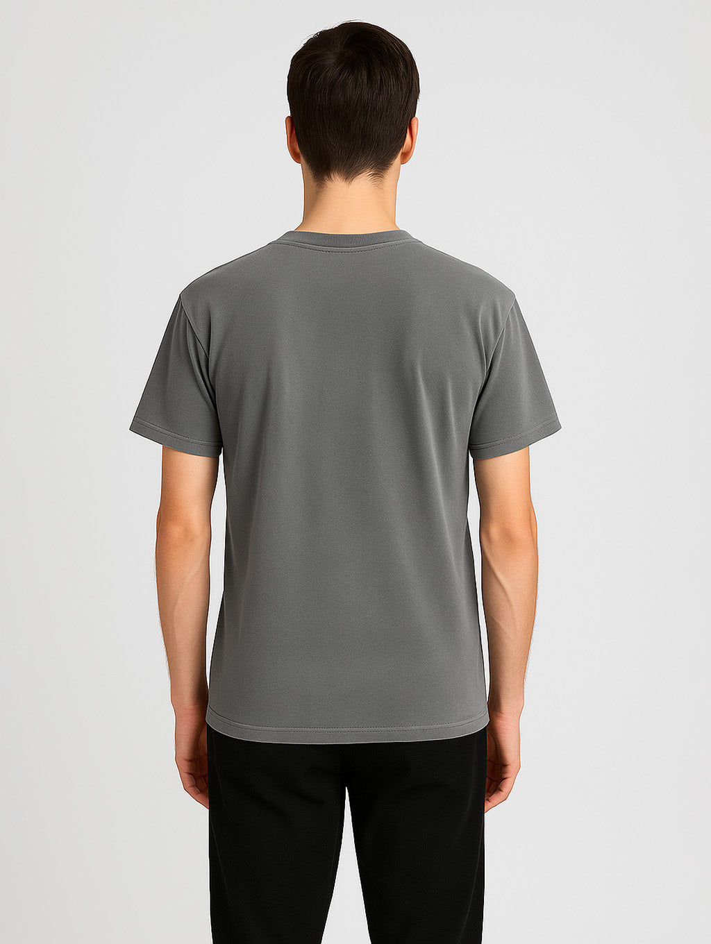 Back view of male model wearing Zarvion vintage t-shirt in Ash Grey – relaxed streetwear fit