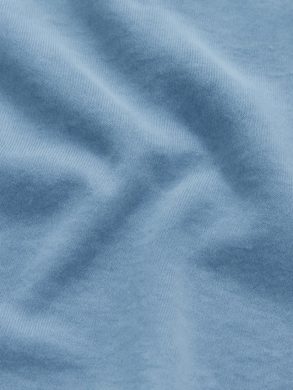 Heavyweight cotton texture of Worn Denim Blue Zarvion tee – soft, breathable garment-dyed fabric detail