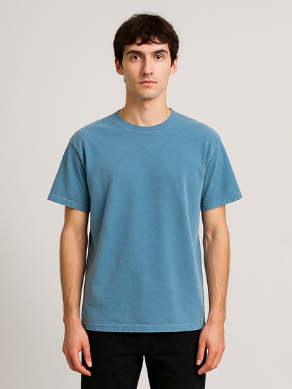 Front view of male model in Worn Denim Blue Zarvion t-shirt – garment-dyed vintage cotton shirt for men