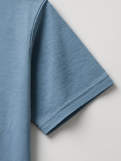 Close-up of sleeve stitching on Worn Denim Blue Zarvion vintage tee – double-needle hem on heavyweight cotton